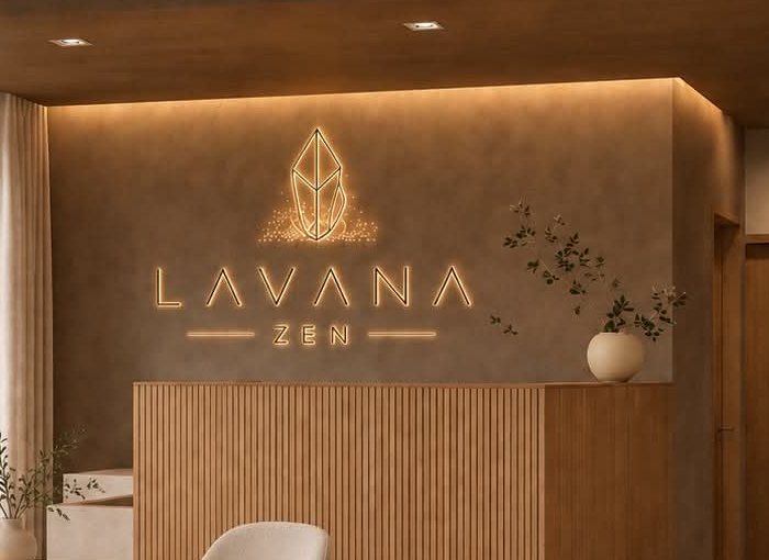 The glowing Lavana Zen logo on the reception wall